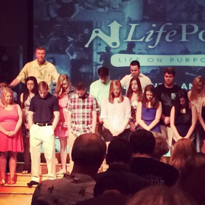 praying over graduates